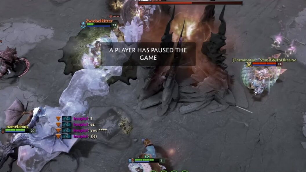 gameplay screenshot from Dota 2 with “a player has paused the game” message