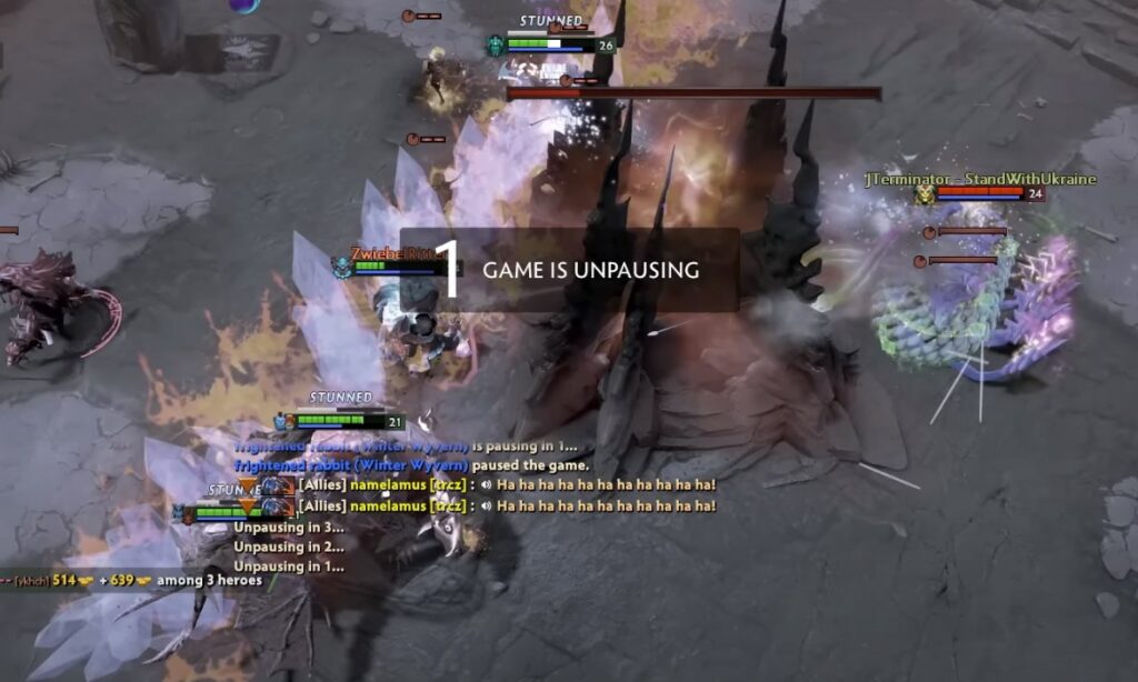 a screenshot of gameplay from Dota 2 with “game is unpausing” message in the middle